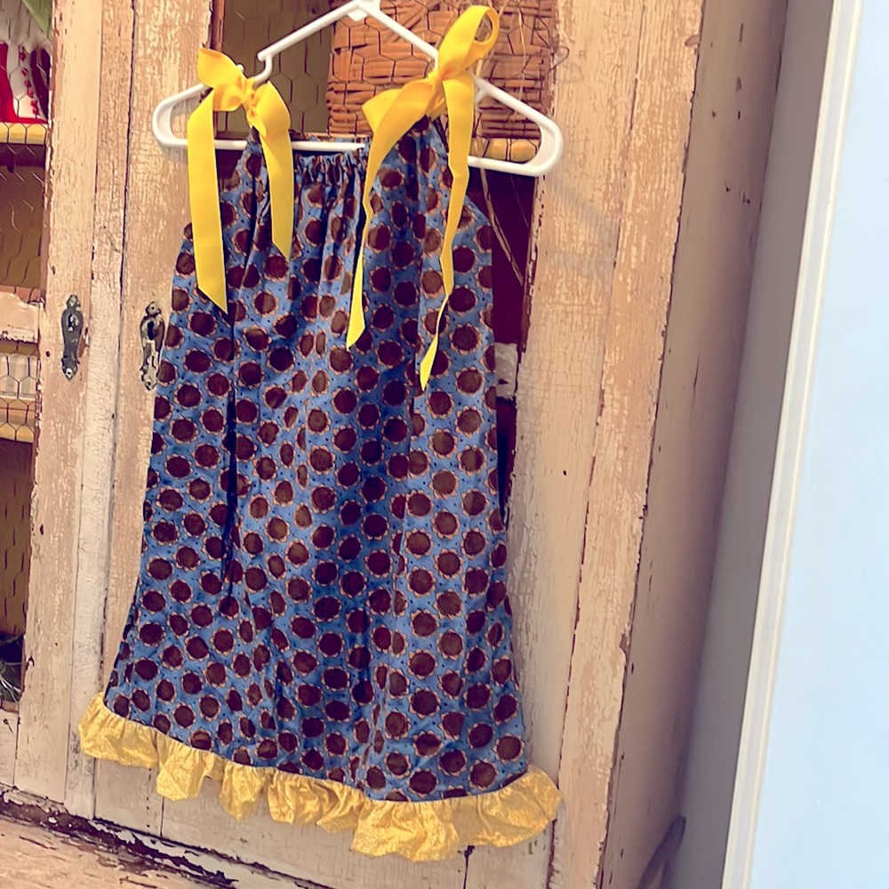 I had this dress hand made for a sunflower field photo shoot. Never used.